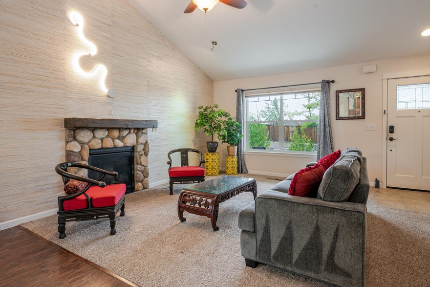 This charming home, built in 2016, has been tastefully updated with unique lighting, wall coverings, and paint that make it feel like you're in a market halfway around the world. Modern appliances and a large kitchen bar with granite tops will make cooking and entertaining a pleasure. The 1882 SF home is spacious and features a wonderful layout, including a primary en-suite bedroom downstairs with two walk-in closets and a sliding door to the backyard. The home is a 3-bedroom, 2.5-bath with an additional bonus room upstairs, perfect for an extra living or family room. There are plenty of storage closets and a full laundry room, and a large 2-car garage. The vaulted ceilings and cozy gas fireplace are a few of the nice extra features of this well-kept home in the quiet and centrally located Clearview neighborhood of Talent.