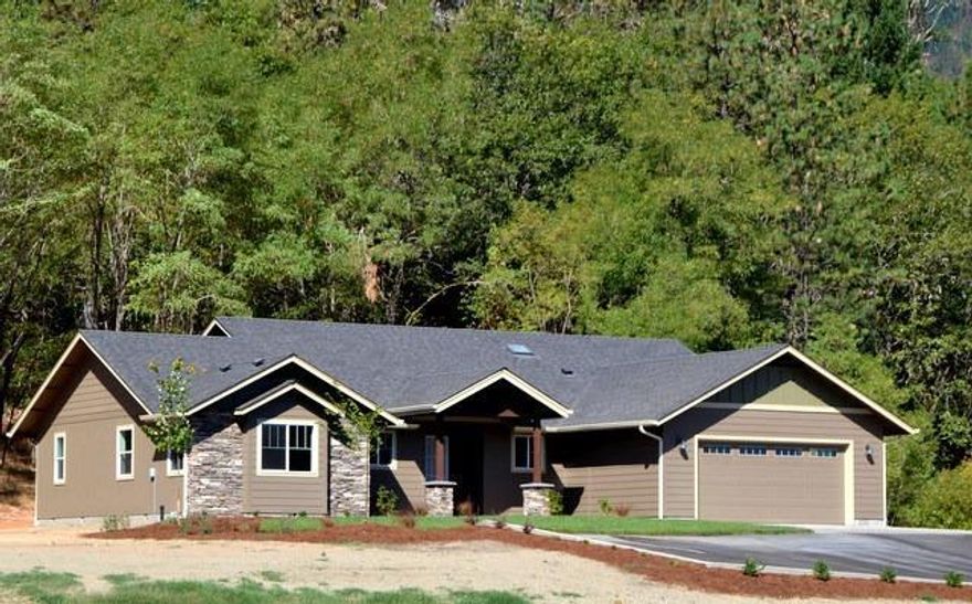 Brand new Custom in the country! Gorgeous lot with most of the 2+ acres being level and the home sits on a slight knoll with a screen of large trees behind it. This custom home has so many great, quality features that you will want. Large gas stone fireplace in the truly great room. Hardwood floors throughout the living, dining, entry and kitchen and an impressive country kitchen with upgraded stainless appliances as well as granite counters. This home is light and bright with many windows and sky lights and solar tubes too. The master suite features large his and hers closets and the master bath has a large walk in shower and soaking tub. There are two additional bedrooms and a separate office too. All overlooking the meadow land below and there is a brand new 24X30 shop. And to top this off a paved driveway and automatic gate and super energy efficiency too. Completion in early July. You won't want to miss this one. This is a true value.