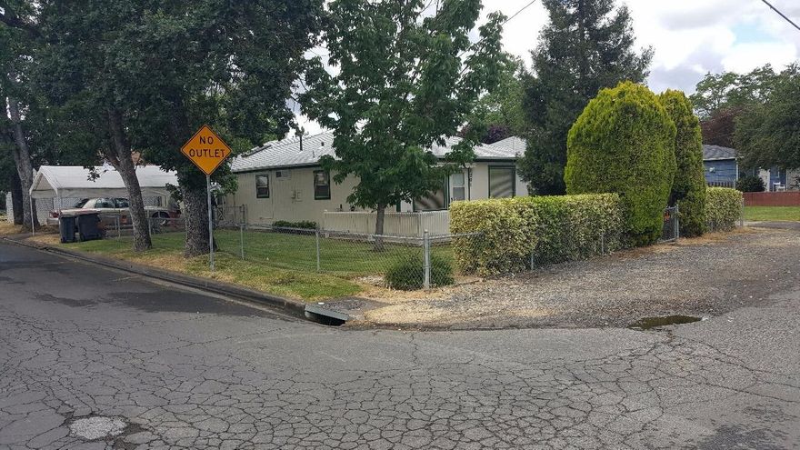 Adorable 2 bedrooms 1 bath home. Newer kitchen with oak cabinets. New roof and gutters, new outside paint per seller. Large walk in closet in master bedroom. Sprinkler system in yard 1 car oversized garage with lots of storage. Large attic for storage. Fenced in side yard beside garage for RV parking or? Off front patio has automatic roll out awning. This home sits at the very end of 11th street.