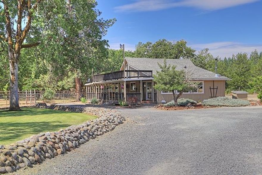 What a charming farmhouse with a great remodel. This 1522 sq.ft. house offers 3 bedrooms, 1 large bathroom, a bright open kitchen, a wrap around covered patio, and lots of character. Not to mention low county taxes. This house sits on 2.5 flat acres that can easily accommodate your RV, toys, animals or whatever you need room for. The property is fully fenced and would make a great mini farm with a nice meadow for horses or goats along with a chicken coop. You will also find a 25x36, 3 bay shop with 220amp service inside and out. A great place to house your cars, trucks, or equipment. There is a fenced in garden area as well as a almond & fruit tree orchard. Don't miss this one. Make your appointment today for a viewing.