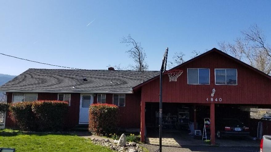 Affordable in Ashland on a .39 acre end of the road lot with great views of the Siskiyous , Mt Ashland and clear into downtown Ashland from back of house.  This home has over 2200 square feet of living space, a 2-story home with full basement for a roomier feel. Main floor is the primary bedroom, bathroom, laundry, kitchen and living room areas. Upstairs attic can be a large family room or another bedroom. Then check out the downstairs basement area that was turned into a great room plus workshop room. From upstairs deck the views are amazing! New roof was installed in 2019 and the hallway bathroom is all new too! Get inside this great home today. Yes, the freeway is right in front, but from inside the home you wouldn't even know it's there! Priced to sell ''as is''  with flooring, heating and cooling replacements in mind and is reflected in the purchase price.