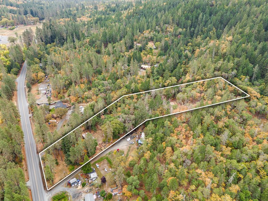 Come Check out this prime property with a 1966 double wide mobile home home holding the site for you to build your dream home.  The property is centrally located south of Grants Pass, tucked away in a wooded area with mature Madrone and Pine trees.  Your future home awaits you with plenty of space featuring 2.62 acres with existing well and septic.  Cash or construction loan only.  Buyer to do their own due dilligence.