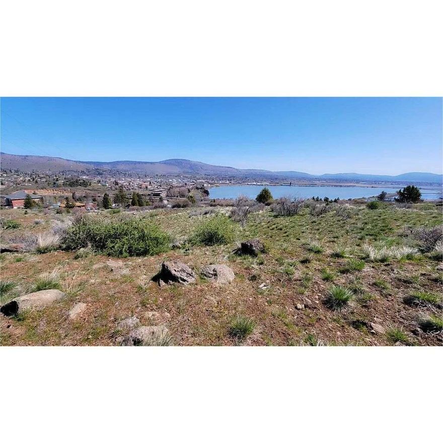 Experience the epitome of tranquil living with this remarkable real estate opportunity nestled in the heart of Klamath Falls, Oregon. .36-acre property boasting panoramic views of Lake Ewauna & the entire Klamath Basin. Perfect for nature lovers w/ nearby birdwatching & hiking trails. Enjoy easy access to downtown amenities while cherishing your private oasis. Build your dream home! Schedule a viewing today to begin your journey towards luxury & beauty. Public water & sewer nearby. Please perform your own due diligence to ensure the property meets your requirements. Don't miss out on this opportunity!