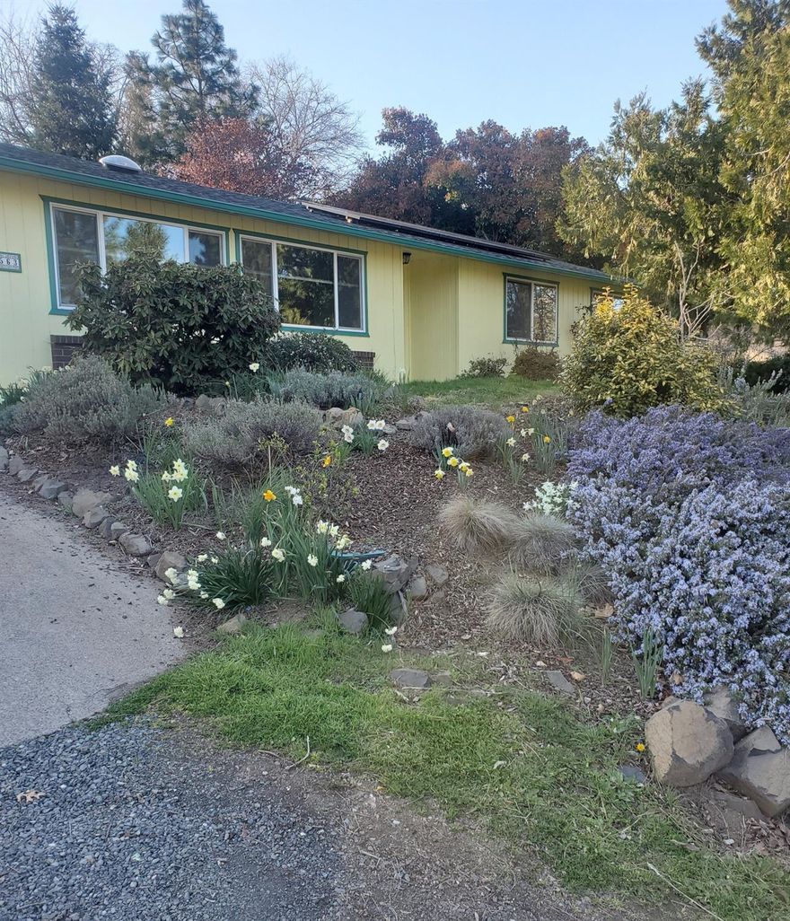 Single level 3 bedroom, 2 bath home in a quiet, friendly neighborhood above the hospital with wonderful views of the hills to the east and city lights. This attractive home has many surprises. Recently upgraded features include: energy efficient windows, roof, carpet, kitchen cabinets, and electrical system. Plus, there is a new garage door, a freshly painted exterior, and a 4.25 KW PV solar system. In addition to a two car garage, there is also a carport. The 0.27 acre is home to large mature trees. There is also an adorable 199 square foot functional Yurt with charming enclosed outdoor shower, and a deck with a gazebo above the house, also with excellent views of the valley. Additionally, enjoy a few raised garden beds, a fenced backyard, and TID water rights. Great value for this view property!