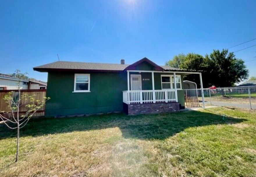 Charming 2 bedroom, 1 bathroom cottage on a great fenced lot! Featuring original hardwood floors throughout, updated vinyl windows, breakfast nook, living room, and large mud/laundry room. Exterior features include single car garage and carport plus paved driveway, landscaped back yard with in ground sprinklers, and a great patio for BBQing or relaxing. Don't let this one slip away!