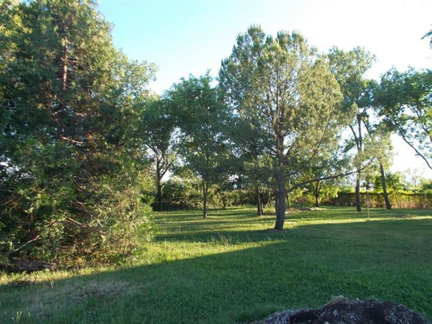 Opportunity is here to build your dream home. Perfect location on 4 acres! Currently there is an older manufactured home that has no real value. There is a strong well (per seller) and city sewer. Enjoy yourself sitting outside under beautiful mature trees and a view of the mountains with a luscious green lawn. Close to the Eagle Point Golf Course. Buyers to perform their own due diligence.