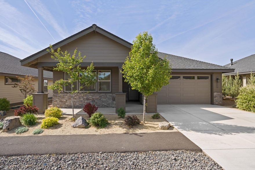 Beautifully designed and move-in ready! This warm, inviting home offers an open layout with a cozy gas fireplace and bright breakfast nook. Gourmet kitchen with quartz counters, stainless appliances, and ample storage. Spacious primary suite and covered patio for outdoor relaxation. Located in a 55+ gated community with a new clubhouse under construction featuring an indoor pool, pickleball, gym, bocce ball, and second floor observation deck. Close to trails, golf, dining, and shopping.