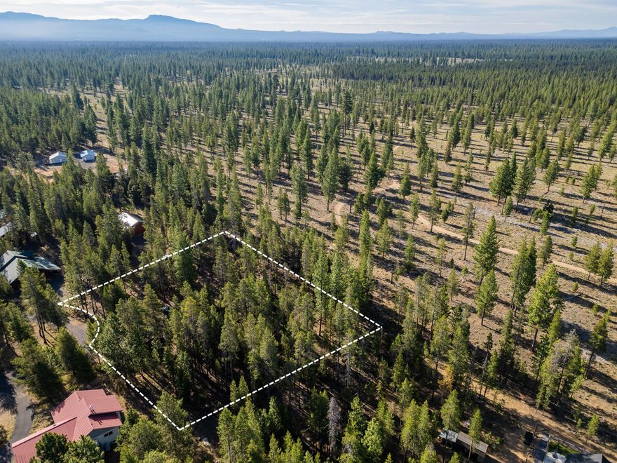 Tucked away in the peaceful Fall River neighborhood, this 0.88-acre lot offers the ideal blend of seclusion and access. With public land bordering the back, you'll enjoy uninterrupted views, added privacy, and regular wildlife sightings. The setting feels remote, yet you're just minutes from the Cascade Lakes and endless trails—perfect for fishing, paddling, hiking, or simply unwinding. A septic evaluation has already been completed, giving you a head start on building. The neighborhood supports a variety of home styles, making it easy to bring your vision to life. Whether you're planning a full-time residence or a seasonal retreat, this property sets the stage for a life connected to nature and adventure. Come explore the possibilities and imagine your future here—quiet, wild, and completely your own.