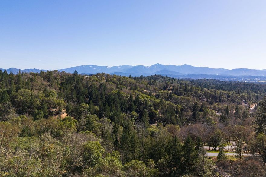 Searching for a spot to build your Dream Home in Southern Oregon? Look no further! This stunning view parcel is set on 5.27 acres with breath taking panoramic views sweeping to the West! Located in a private neighborhood of custom homes close to Grants Pass. Including approx. 25gpm shared well and septic approval with roughed in driveway leading to potential homesite surrounded by a mixture of beautiful oak, fir and madrone trees. Come tour all the buildable parcels High Ridge Terrace has to offer in a carefully thought-out subdivision with CC&R's to protect the neighborhood's integrity. Bring your builder and start planning your custom home today!