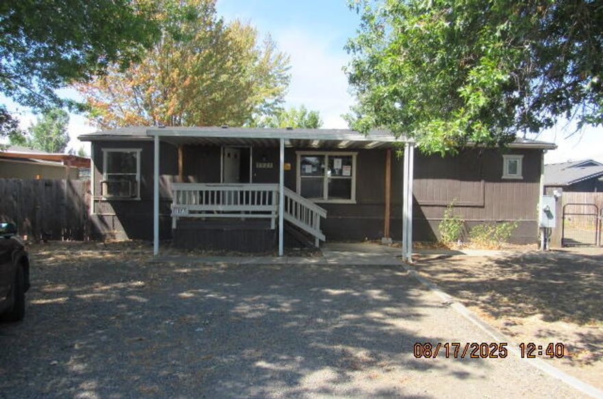 Potential!!!!  Large .19 Acre lot, open floor plan with 3 bedrooms, 2 bathrooms.  Covered front porch.  Located within an hour of lakes, hiking trails, waterfalls, and the Rogue River.