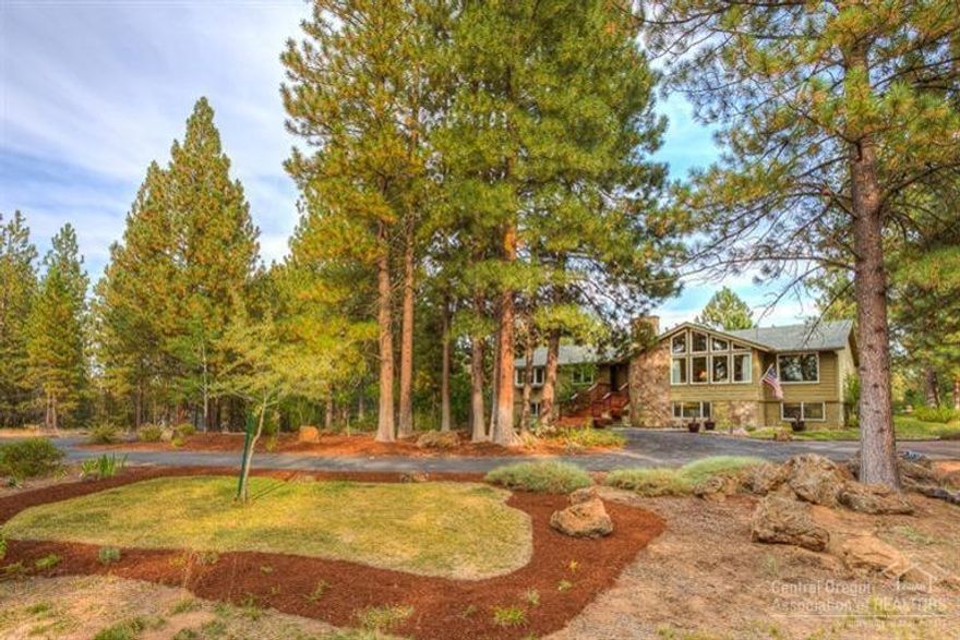 Lovely home in peaceful Woodside Ranch, minutes to downtown Bend. Tastefully remodeled by SunForest in 2002, great room with rock fireplace, vaulted ceilings, formal dining and eat in gourmet kitchen with island, pull outs, tile floor and plenty of counter space. Large open media room downstairs with separate office & bath (could be a separate living area), central Vac & A/C. Spacious back deck & paver patio overlooking the beautiful gardens & just a few steps to National Forest Land access.