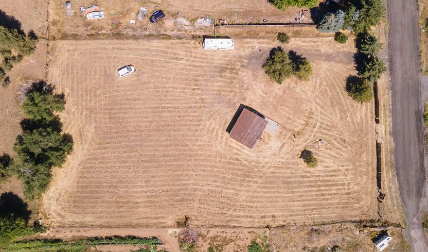 Ready for your new home-this 1.12 acre parcel in Klamath Falls. is waiting for your manufactured home or build plans! Features include power, city water, and septic. There is a garage that is in need of repair. A manufactured home was recently removed from the site. Property sold as-is.