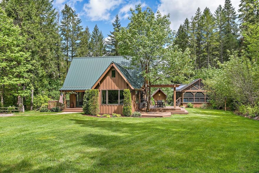 You asked for it and here it is! Total privacy in this wooded retreat on almost 30-acres of lush trees, year round Elk Creek all with gorgeous grounds and an exceptional home. This home has been wonderfully cared for, updated and the details are amazing. From the Fir flooring made from trees on the land or the Geo-Thermal heating and A/C. 42-Gallon per minute well per owners, pole barn, 2-large pasture areas, 3-car garage/shop with woodstove plus a large loft above to make your guest bedroom. A lap pool that's enclosed and has beautiful decking is out back and the kitchen is set up for the professional chef that includes a 6-burner dual fuel range, built-in refrigerator and all the stainless appliances. The family room boasts a beautiful Soap Stone Woodstove and wonderful views of the trees and abundant wildlife. Most of the property is fenced and it all sits behind an electric entry gate. Make your appointment today! Only 17.5-miles up Hwy 227 from Trail.