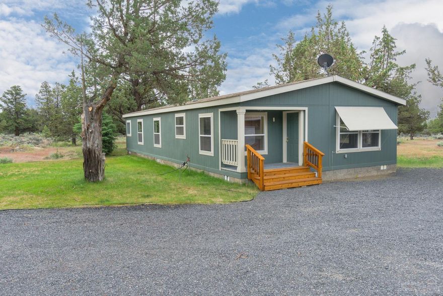 Neat-as-a-pin move in ready with new carpet and vinyl. Even the washer & dryer stay, plus you get an extra refrigerator & freezer in the 24x36 garage/shop with 2 overhead doors, many doors, shop area & additional 10x12 covered area. Notice the attractive awnings over the windows that helps keep things cool as well as the southerly views from this home. Bring all your toys & enjoy the peace & quiet from this perfectly located acreage between Bend & Redmond!