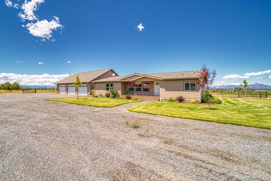 Beautiful newer triple wide with open great room, split floor plan and nice upgrades throughout. Kitchen has nice eat at breakfast bar and dining area has built in cabinets for plenty of additional storage or bar area, large back deck overlooks the 78 acres with half pivot and nice Cascade and Smith Rock views. Detached garage is 2112 sq ft with separate shop area.