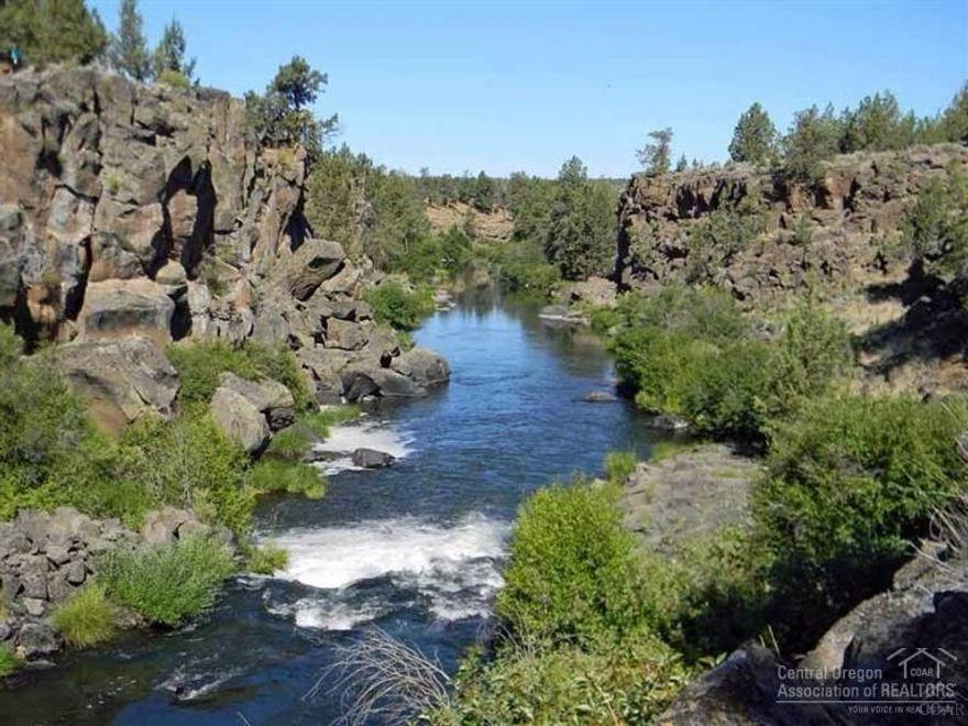 Premium Riverfront property in Central Oregon with phenomenal waterfalls & Cascade Mountain views. This ranch is all about peace & privacy within a 44-acre master planned and gated compound on the banks of the Deschutes River wile & scenic area. Planned with both the equestrian and fisherman in mind, this sanctuary is remarkable in its natural beauty & serenity. Original house & barn on Lot 1 of 6. Each lot with private well & underground utilities plus high speed internet. A ranch ready to build!
