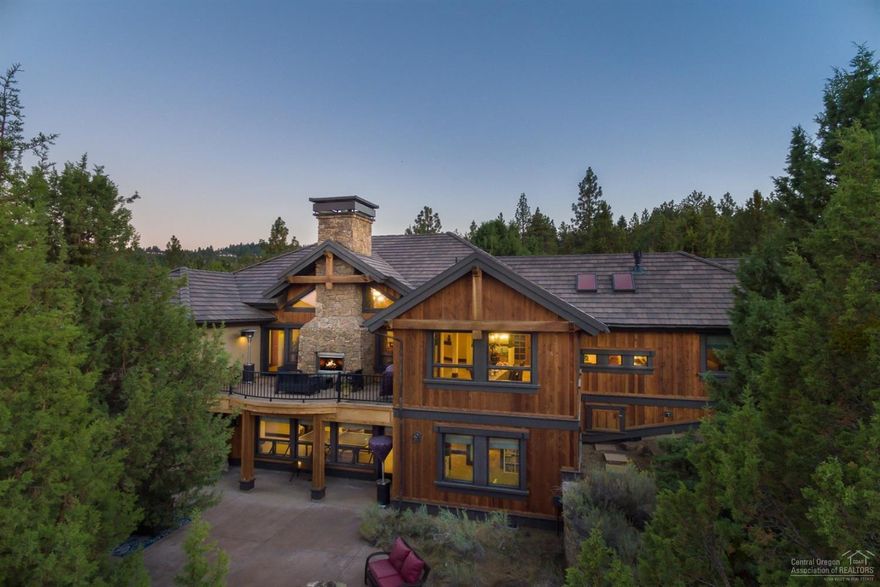 Experience luxury living in exclusive North Rim. Stone & distressed wood beams create a rustic elegance; entertaining in style is easy . Master, office & guest suite on main with 2 en suite bedrooms. Gym/Bonus on lower walk-out level. The great room reveals a gourmet kitchen with oversized granite island & barn door pantry, a beautifully framed dining area & impressive stone fireplace at the heart of the home. Outdoors you'll love the heated driveway, gated community with Clubhouse, tennis, park, & trails.