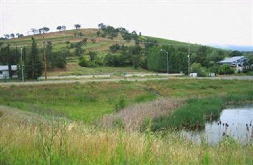 One of three lots with shared access; walled entryway.