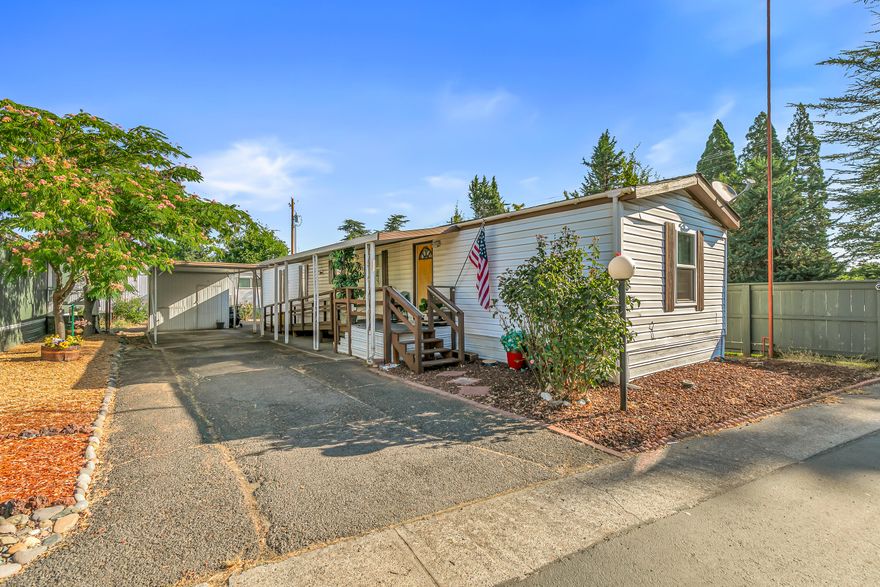 Welcome to this beautifully maintained single-wide home in a vibrant 55+ community, ideally located near shopping, dining, and easy freeway access. This light-filled residence features a desirable split floor plan with a generously sized living room and a spacious primary suite complete with double closets, dual vanities, and both a tub and separate shower. Recent updates include a new roof, new flooring, a new water heater, and an energy-efficient mini split system for year-round comfort. Enjoy a low-maintenance lifestyle in a peaceful neighborhood with all the conveniences right at your doorstep. Move-in ready and the perfect place to call home!