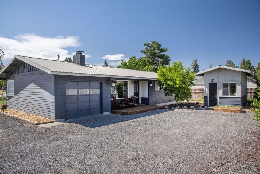 This nicely updated home situated on a huge, level lot features plenty of RV parking with an 220 volt hookup.  The home is darling- with brand new laminate wood-like flooring, 24'' tiled countertops, a coffee nook, wainscoting in one of the three bedrooms, beautifully updated bathroom with a gorgeous vanity and sconces. The detached shop, currently used as a gym, is finished, heated, with two windows provide a light and bright space, could be whatever you need- home office, extra bedroom, workspace, etc. So much to offer here at this conveniently close-in SW Redmond location (just 12 minutes from the north end of Bend and 5 minutes to the airport).  A definite must see, it's dialed and ready for it's new owner!