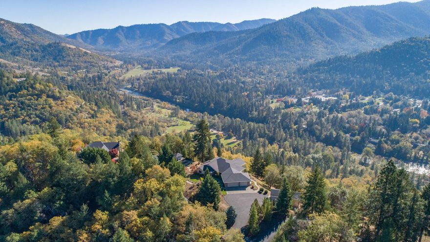 Grand views, privacy & elegance - this custom Dave Adams Home will take your breath away. Come live where the Eagles Soar; the views from this home are magnificent. Inside, the wall of windows bring in the love of the outdoors, creating a light & bright setting for every season. Open flr plan incl Kitchen, LR w/gas fplc & Bkfst nook. Sep DR & Ofc. Home is adorned w/quality materials & craftsmanship. Truly too many features to list here, so ASK for the Features List. Briefly, the home has oak flrs, cabinets, doors & trim. Gourmet Kitchen has cherrywood cabinets w/pull-out shelves, solid surface counters, bkfst/sous chef bar, Lg island & walk-in pantry. Primary BR fits Lg furniture, has deck access/w-in closet/Spacious BA w/w-in jetted tub/shower, Dual sinks/encl toilet rm & soaking tub w/views. High end elevator takes you to a family rm, Jr PBR Ste & bonus rm. In-law Qtrs? 3 car gar. Huge Shop for Encl RV pkg+Wkshp area+BA w/sink & toilet. Add'l RV pkg w/full hkups. ASK for Videos!