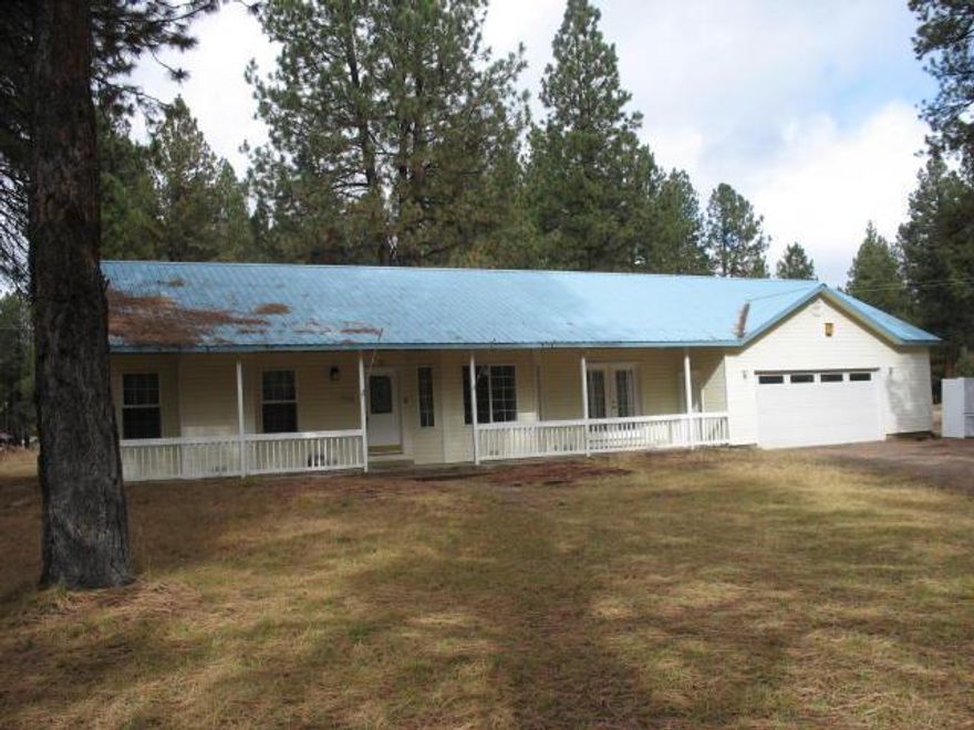Great 2 bed/2bath, 2 car garage stick built home on 1.91 acres. Covered front porch area. Living room & dining room offer vaulted ceilings, several windows & french doors for lots of natural light. Property is all fenced, nicely treed, electric heat and pellet stove. Peaceful & private.