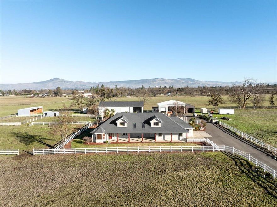 Welcome to this exquisite ranch-style home, a perfect blend of comfort and functionality, sprawled over 2,000 square feet. Designed with in-law quarters in mind, this residence offers a warm and inviting atmosphere, ideal for multi-generational living. Step outside and discover your own private oasis featuring a stunning inground pool, perfect for relaxation and entertaining. Set on a generous 5.57 acres, this property is a dream for animal lovers. You'll find a spacious pasture, ready to accommodate cows or other farm animals, along with well-constructed stalls designed for horses or cows. The highlight of the property is undoubtedly the impressive apartment/workshop, measuring 2575 sq. feet. This exceptional ranch-style home offers a unique lifestyle, combining luxury, functionality, and the tranquility of country living. Don't miss the opportunity to make this dream property your own!