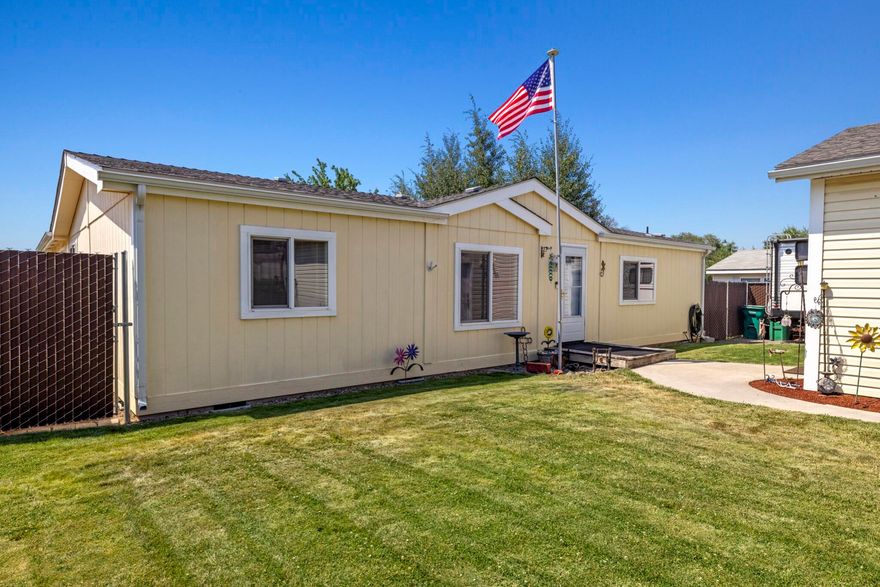 Don't let the ''manufactured house'' term keep you from viewing this beautiful, well-maintained home. Walking into this home immediately shows pride of ownership; the open-concept, split floor plan provides privacy for the primary suite and the 21'x22' addition of two sizable bedrooms, and a storage closet provides ample room for a large family or multi-family living. The backyard is a little paradise with a paver patio, gorgeous trees and lawn, and 600' of privacy fencing and there are inground sprinklers in front and back. The two-car detached garage is 24'x24' with full electric, two 220, 30 amp outlets and heaters; RV parking is available too! So many recent upgrades...central air/heat pump, fencing, water heater, fascia and gutters, vinyl double pane windows, and roof. Please review all property information and make your appointment today!