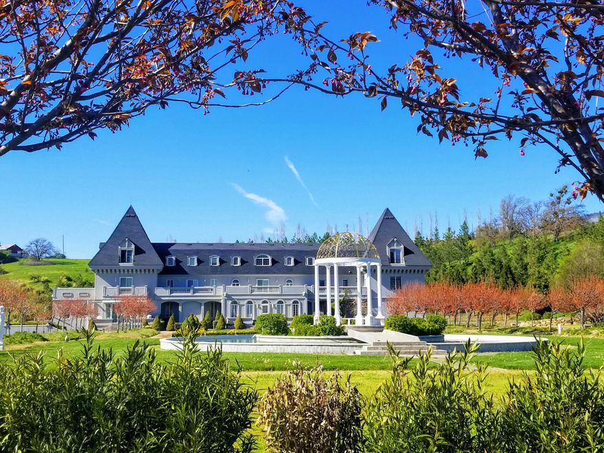 Meet Herbe II. A waterfront Chateaux Estate, Ashland OR. It's 27.+ gated LUSH acres are luxuriously landscaped w/1000's of plants. Fine wine producing vineyard. Owner artistically crafted each detail in Herbe II build. A replica of the French Chateau Herbe. ICF Construction. Elevator to 3 floors. Fountains. Marble lawn statues. Solar/Ele. An alluring destination that captivates the soul. A potential premier location for weddings, B&B, Airbnb, music, & accommodations for OSF.  Tenants are on a month to month lease. Buyer perform own due diligence