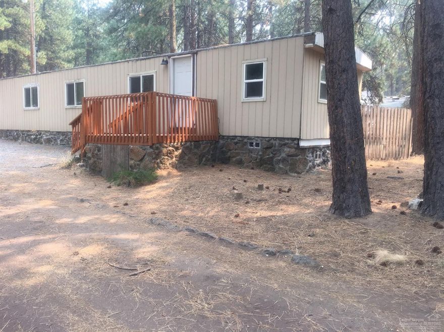 This great investment property is located in the iconic Deschutes River Woods. Tucked back on a nice paved road with mature ponderosa pines. This manufactured home features new floors throughout and detached garage with plenty of room for storage. Come view this property today.