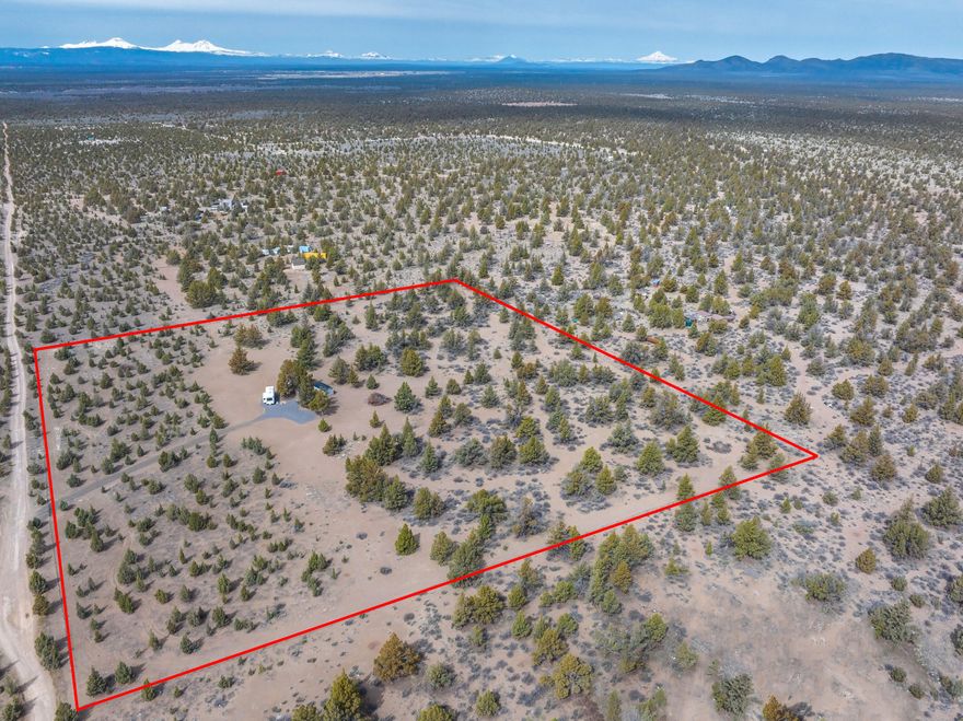 Discover your own private retreat with this beautiful 10-acre recreational parcel in Juniper Acres. Nestled among mature trees for added privacy, this mostly level property features a 2010 Keystone Copper Canyon 5th wheel, Hickory Shed for storage. A gentle rise offers stunning views of the Cascade Mountains and surrounding high desert landscape.
Ideally situated just 10 miles from the Powder House Cove boat ramp at Prineville Reservoir—renowned for its excellent fishing and water activities—and only 4 miles from the Millican Valley OHV area, offering thousands of acres for off-road adventure and public recreation.
Whether you're looking for a weekend escape or an off-grid basecamp, this parcel offers a peaceful setting while still being just 40 minutes from Prineville, Bend, and Redmond Airport. Located in an area well-suited for solar and wind power. Don't miss this opportunity to own a slice of Central Oregon paradise.