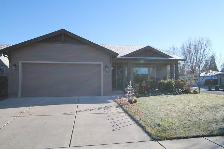 Craftsman style Cota built home, just became available. Placed on a corner lot, this quality open floor plan is very inviting. Granite kitchen counters, Alder wood cabinetry & oak hardwood floors, dress up this cozy home. Enjoy the vaulted ceiling & fireplace in living room, and take advantage of the covered back patio for those evening bbq's. Covered front porch adds to the curb appeal and style. The master has vaulted ceiling, walk-in closet w/built-ins. Fenced backyard w/gate that opens for RV. Completely landscaped front & back w/sprinkler system. Great opportunity, great location!!