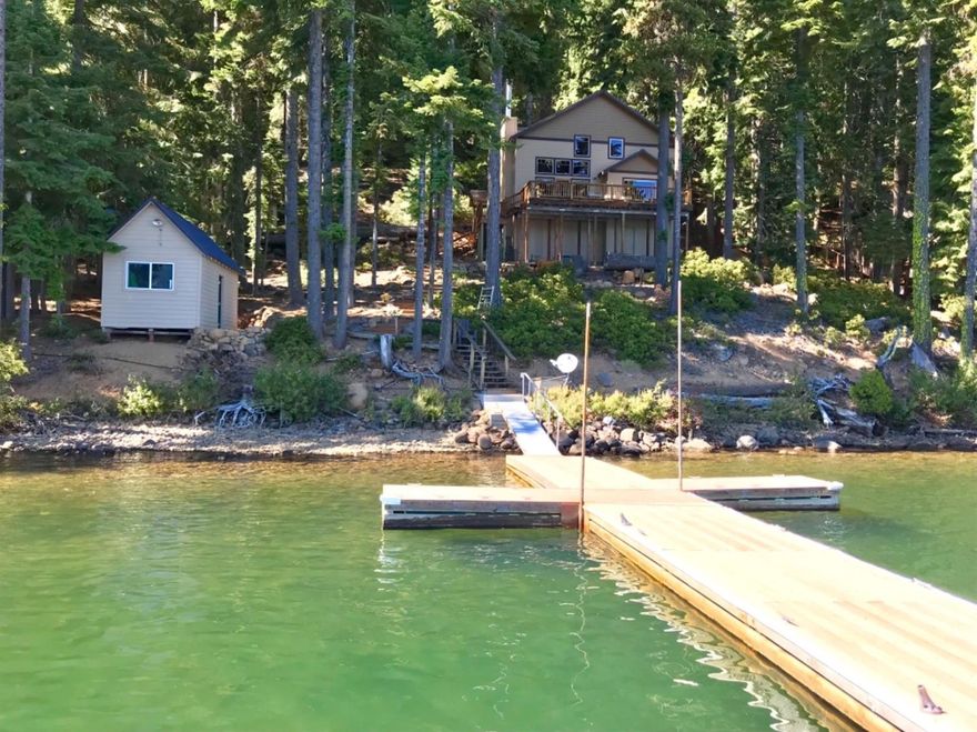 Absolutely AMAZING West Side Lake front Cabin at Lake of the Woods in the Cascade Mountains in Southern Oregon! This is a truly once in a lifetime opportunity to own one of the nicest cabins on the lake! Breathtaking floor to ceiling rock fireplace, soaring ceilings, large windows capture the stunning views of the lake and nearby mountains. Recently refinished deck overlooking the lake and a private dock with 4 boat slips. Home is very nicely appointed with a large chef's kitchen w/ eating bar, dining room, main level master, 3 additional upstairs bedrooms and a full bath. Year-round recreation: swimming, fishing, boating, water skiing, jet skiing, hiking (Pacific Crest trailhead nearby), snow shoeing, snowmobiling (over 300 miles of groomed trails) & cross-country skiing. Resort area offers dining facilities, general store, marina and live weekend entertainment in the summer months. Immaculately maintained and absolutely turn-key.