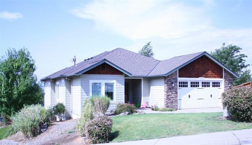 This large beautiful home located in NE Grants Pass is close to schools and shopping, in District 7 schools. Plenty of room for friends and family offering 4 bedrooms 3 full baths, living room, family room, and office! Many upgrades through out lots of windows and natural lighting. Home has triple pane windows, nice deck off the living room upstairs to enjoy you morning coffee, with a covered patio below. Also a 3rd Hobby garage under the house. Call today this one will go fast at this price!!!