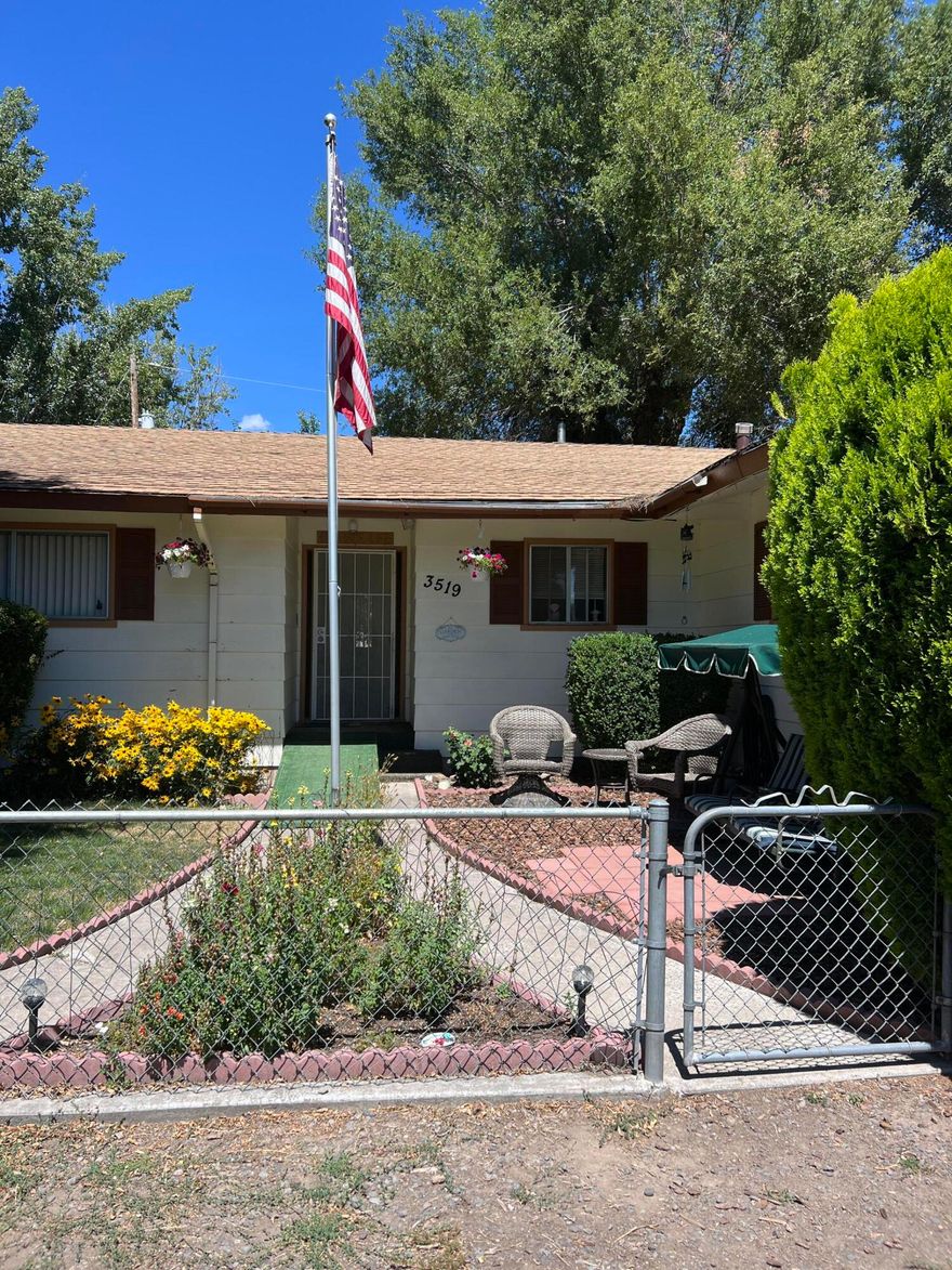 Must see new flooring. Priced to sell! At under $160 per square foot, this is a bargain. Not only is this a large house with 2002 square feet but it is situated on just over 1/3 acre, completely fenced. While this house is stuck in the 70s, there is so much potential for updating and making it your own. There is a two-sided fireplace, one side in the huge family room and the other in the living room/office, currently set up as a 4th bedroom. Inside laundry room and large primary suite are desirable features. The yard is amazing with three storage sheds, fruit trees, side yard access, and an attached carport in addition to the two-car garage. New flooring throughout to be completed by first of November.