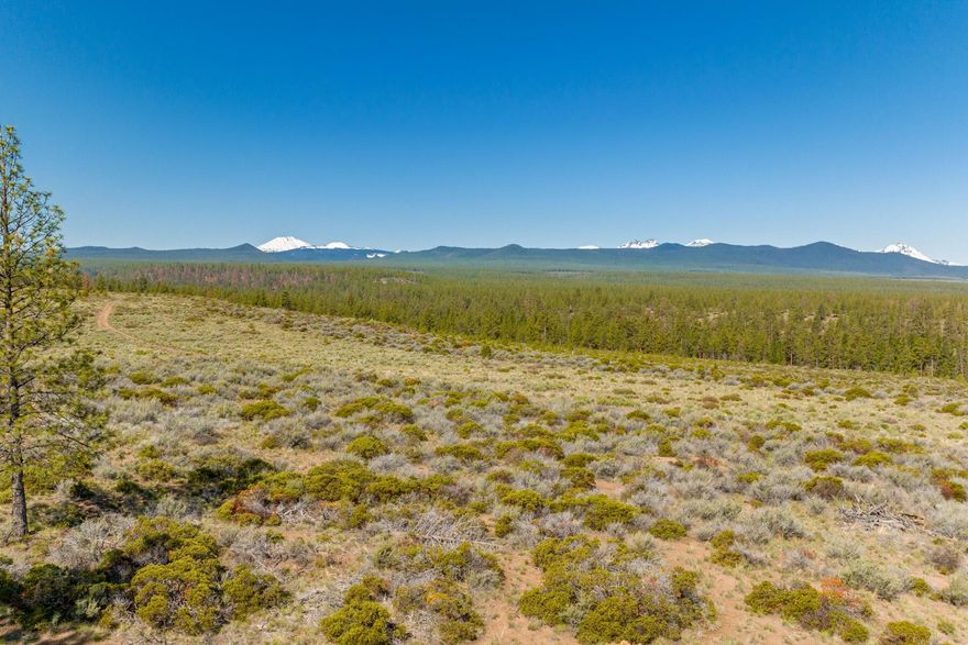 Nestled against protected and public lands, this remarkable, nearly 3.5-acre lot in Westgate presents an unmatched  canvas for your dream home. The awe-inspiring natural beauty that surrounds this property is unrivaled, and this homesite seamlessly blends with the tranquil ambiance of Shevlin Park and the panoramic views of the Cascade Mountains and adjacent National Forest. The gentle slope of the lot provides an ideal foundation for your architectural masterpiece, enabling you to design a home that maximizes the views and harmoniously integrates with the natural topography. Set among some of the most beautiful vistas Bend has to offer, this location allows easy access to the trails, dining, parks and activities that make Bend's westside so desirable. This is a rare opportunity to  create the home of your dreams in one of Bend's most sought-after locations. Embrace the beauty, tranquility, and convenience that this extraordinary property offers.