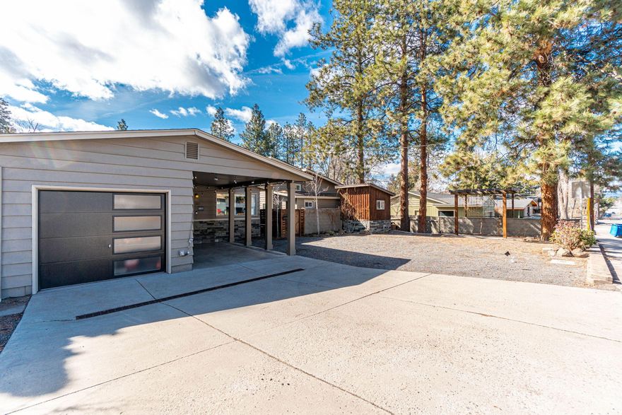 An incredibly unique property in Midtown Bend. 3 single story residences on one lot with plenty of extra paved parking and 2 RV dump stations. Unit #1 is a 1,132 sf, 3 bedroom/2 bathroom home, built in 1958. It has been tastefully remodeled and has been a successful Airbnb for 2 years with access on Olney. Unit #2 was built in 2019, 800sf, 2 bedroom/2 bathroom home with insulated glass garage door opening to a patio. The 3rd living space/Casita is a remodeled 560sf finished garage w/1 bedroom and one full bath plus washer/dryer hookups and glass garage door opening to separate patio. Both #2 and Casita have paved parking off alley access. Call your favorite Realtor, these homes are a must see!
