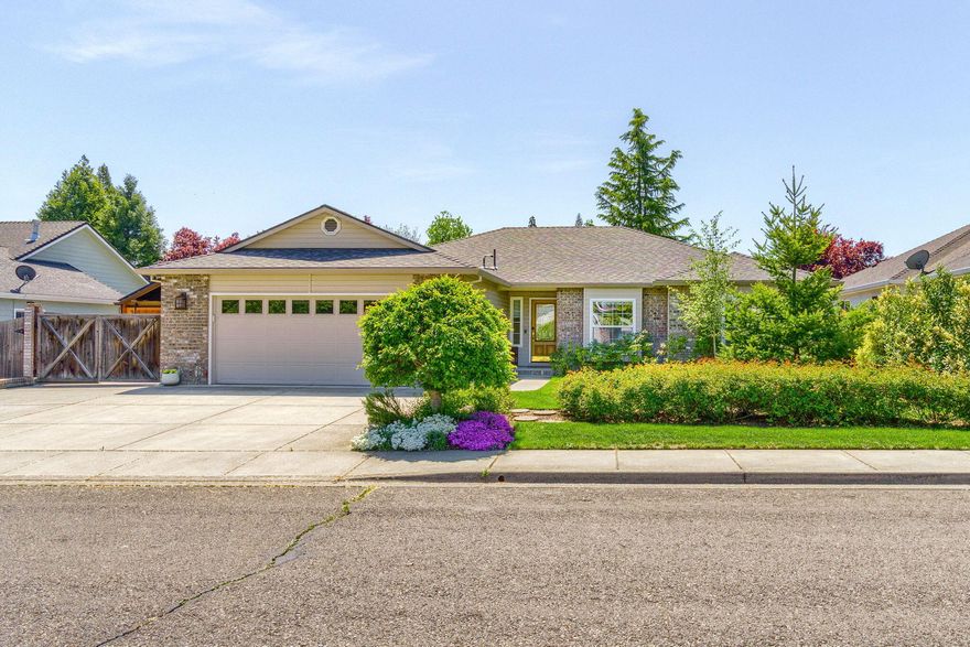 Beautiful single level home with contemporary open floor plan in desirable neighborhood with a country feel. Nicely updated with Euro-style kitchen boasts Corian counters, wide subway tile backsplash & dining bar.  Primary suite with dual closets & walk in shower. Total 3 bedrooms & 2 baths. Hardwood floors, gas fireplace. Many upgrades: owned solar system, new roof 2023, 11x13 workshop with barn doors  & electricity, outdoor lighting, RV parking with water hookup & more!  private rear yard that enhances your living experience.  Gazebo living area with brick BBQ,  designer fan, & twinkling lights creates a private haven. Come see this beautiful home with great backyard oasis! Home warranty also to be transferred to new buyer.