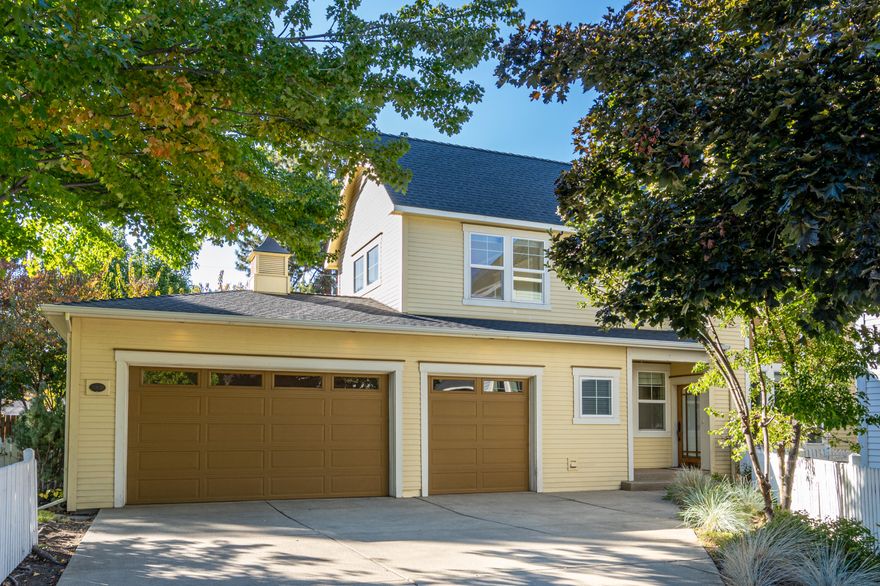 Beautiful Rozewski-designed home on a quiet cul-de-sac in the desirable SW Cloud 9 Estates and only a mile to the Old Mill District and River Trails. High quality craftsmanship and finishes throughout including built-ins, wainscoting, crown molding, and solid hardwood floors. Great room w/ gas fireplace, primary bedroom on the main floor, plus a large bonus room/loft/office and newer carpet. Enjoy the main level primary w/ fireplace that opens to a patio, bath w/ dual sinks, walk-in closet. Central vac, A/C, oversized 3 car garage, private fenced and landscaped yard w/ sprinklers. Cascade views from second floor and mature landscaping top off the charm of this roomy home off a quiet dead-end street.