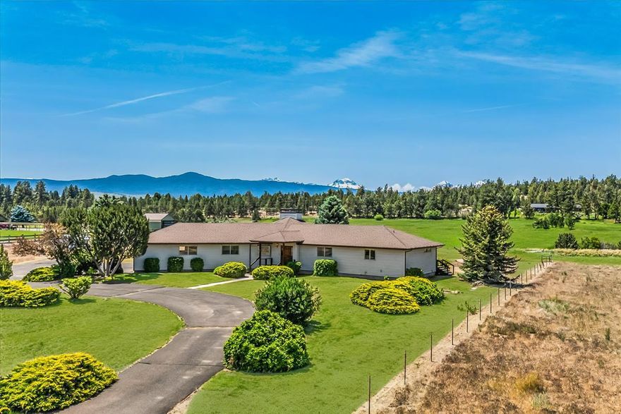 Looking for space, privacy, and Central Oregon charm? This custom-built home on 8.64 acres really delivers! Complete with Cascade Mountain views, fenced pastures, and 5 acres of Tumalo irrigation for livestock or gardening.
Step inside to discover new flooring and blinds, a flexible 3+ bedroom layout (possible 4th bedroom or den), and 4 bathrooms — with each bedroom en-suite for comfort and convenience. The main-level owner's suite features direct deck access, perfect for morning coffee with a view.
Outside, enjoy a circular driveway, mature landscaping, fenced dog run, and storage shed — plus a peaceful setting on a private road just 15 minutes from Bend's Costco  complex.
This home offers the perfect blend of move-in-ready upgrades and opportunity to personalize. Whether you're dreaming of multi-generational living, a hobby farm, or just wide-open space, this Tumalo property is a rare find!
Don't miss your chance to make it yours — schedule a showing today