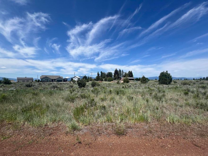 Build your custom home on this level 0.28-acre lot in Oregon Shores Unit 2 near Chiloquin, Oregon. Located in an area for stick-built homes only, this parcel offers mountain views, open skies, and a peaceful setting. Zoned R-2, with access to a shared community water system. Electricity is nearby—buyers should verify availability with the utility provider. Oregon Shores offers a low annual HOA fee with access to a private park, boat launch, and recreation on scenic Agency Lake. Maintained gravel roads and community standards support long-term neighborhood appeal. This lot is ideal for a full-time residence, vacation home, or investment. Just minutes from the Williamson River and Crater Lake Highway, it blends rural tranquility with outdoor adventure. A great opportunity to own land in Southern Oregon.
