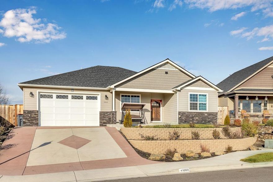 Fabulous East Medford neighborhood! This almost new home is located in the desirable Cedar Landings subdivision. Wonderful setting with views of the pond and wild birds from the front porch. Sought after split floor plan with open concept living. The beautiful kitchen has gorgeous light granite countertops, an Island, Alder cabinets w/pull out drawers & upgraded Stainless steel appliances. The contemporary tile flooring looks like marble and adds to the sophistication of the homes design. The master suite has a walk-in closet, jetted tub & tiled shower. The backyard is fully fenced with a covered patio for outdoor relaxation. Here is your opportunity to be a part of this great friendly community!