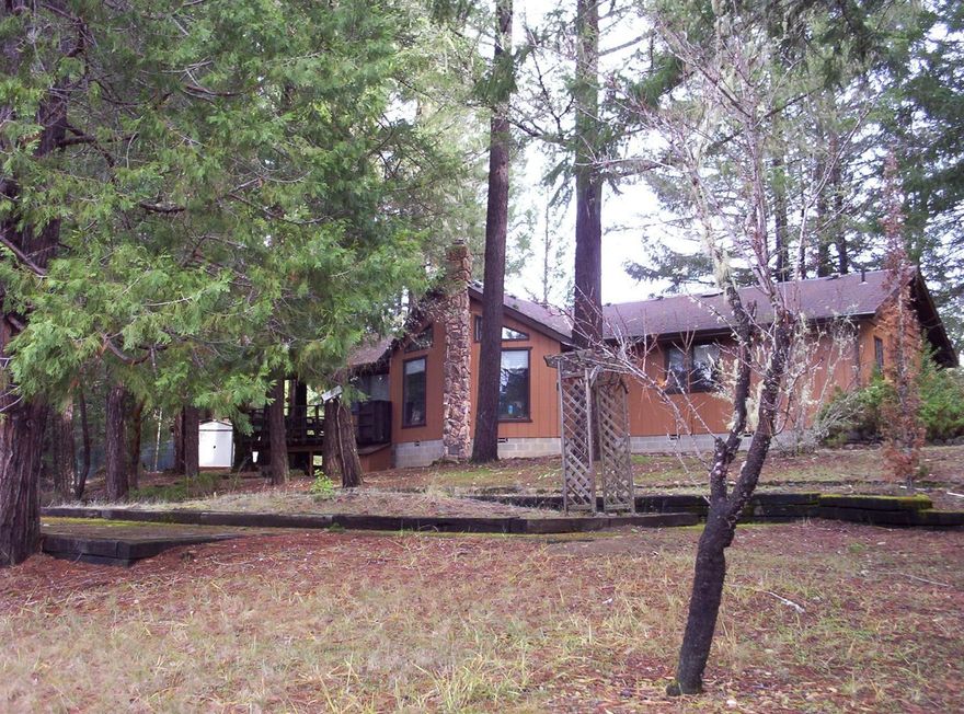 Very private end of road creek front treed property, total of 17.72 acres. 2 tax lots zoned RR5, one 5.39 acres, one is 12.33 acres. Level to slightly rolling with spring feed pond. The 1994 square foot home sits on the 12.33 acre parcel behind the 5.39 acres. Built in 1982 this single level 4 bdrm 2.5 bth home offers open beam tongue and groove ceiling, wood stove large windows looking over the pond, family room, partial basement & more. Also there is a detached over sized garage with a complete heated studio w/bath over top. Separate work shop & wood shed.