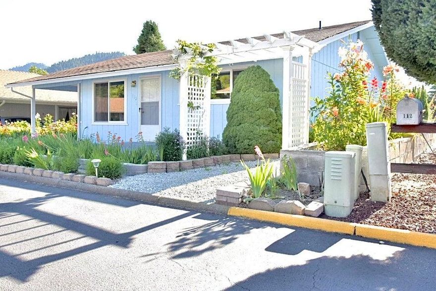 Cute cottage home in Brookside Village 55+ community.  This home has been well cared for with upgraded walk-in tile shower, new flooring, new ductless mini split HVAC system, new carpet,  beautiful mountain views and raised garden beds for flowers or vegetables. HOA fees for the community is $102 a month and includes: Clubhouse, Pool, Water, Free RV Parking and Sewer. Don't wait! Make your appointment to see it today!