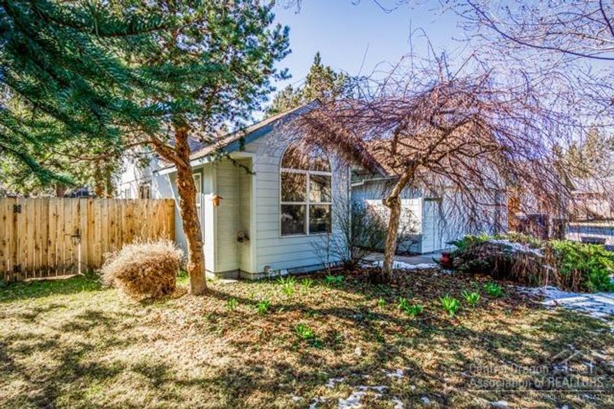 Welcome home to an adorable house and a beautifully landscaped setting! This home has Jojoba hardwood floors, slate kitchen floors, spacious kitchen with breakfast bar, wood wrapped Jeld-Wen windows and doors, heat pump with A/C, and cozy wood stove. The space off the kitchen could easily be used as a second living space. The trees, perennials and raised vegetable beds make this home a gardener's paradise. Exit the lovely French doors to enjoy meals on the large rear decks or relax in the very private side yard. Storage shed for all your toys!