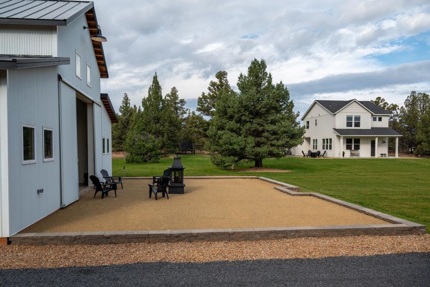 Offering 9.83-acres of pure privacy, where contemporary luxury meets the tranquility of Central Oregon living. Step inside the main residence, designed w/ an open-concept layout for easy living & light filled spaces. At the center of the property lies a stunningly finished 36'x48' barn, featuring 240v electrical service, a heated office, & a generous workshop area. The barn is equipped w/ a oversized 12'x14' roll-up door, providing ample space for RV storage or transforming it into the ultimate entertainment venue. This RR10-zoned property is ready for the Accessory Dwelling Unit (ADU) & already equipped w/ pre-trenched infrastructure for seamless expansion. Surrounded by beautiful landscaping & fully irrigated grounds, this luxurious estate perfectly harmonizes modern sophistication w/ serene outdoor living.