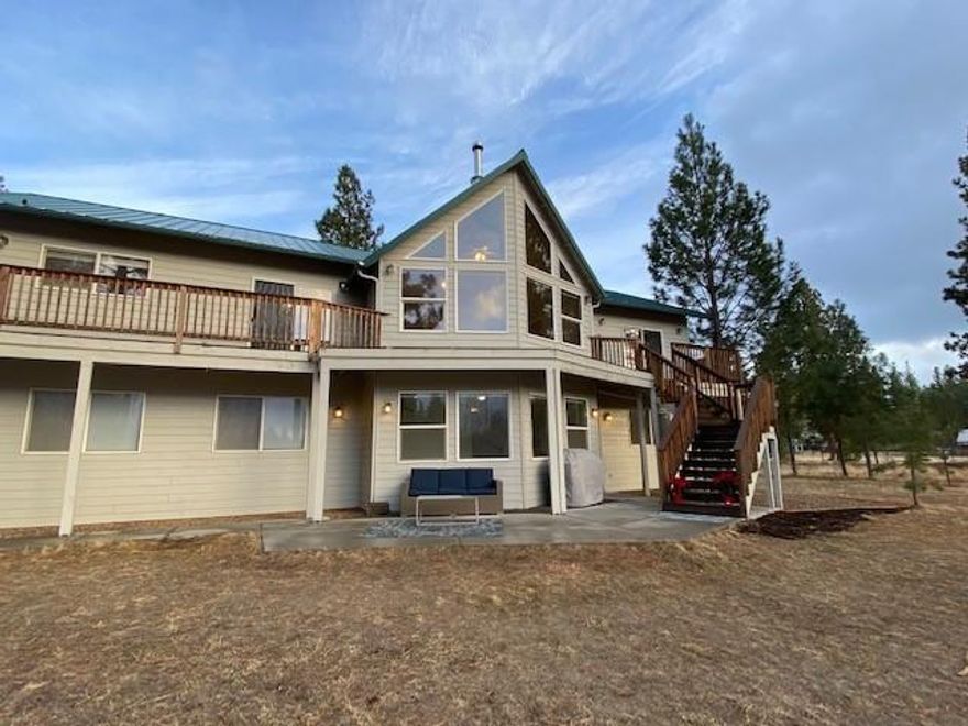 Enjoy the views of the Cascade Mountains from the wrap around deck or from the large living room windows by the wood burning fireplace. This home sits on 9.65 acres and includes a 50 x 35 ft shop, large enough for 4 additional cars, RV storage, office and storage. This 4 bedroom, 3 bath home has new carpet, floors, well pump, newer heat & A/C and more. Must see. Fantastic location just minutes to central Bend.