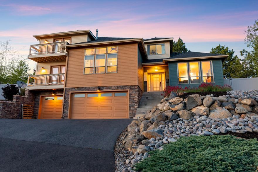 Custom contemporary home in the desirable Hot Springs area! Located just minutes from the Hospital, OIT, and Downtown Klamath Falls. Featuring an open floor plan with vaulted ceilings in the living room & a gas fireplace, plus bonus room, formal & informal dining. The spacious kitchen provides granite counters, stainless appliances, pantry & an island with gas cooktop & bar seating. The primary suite boasts its own private balcony, soaking tub & a great walk-in closet. Relax or entertain on the back patio & take in all the beauty this yard has to offer, including a soothing water feature. Terraced landscaping with sprinklers, raised garden beds, gazebo, deck with views, greenhouse & hot tub ready patio area. Built-in speakers wired for sound both inside & out. Abundant storage in walk-in attic & basement area with 3 car garage, plus gas forced air heat & AC. Additional nearby attractions include a paved path/ biking trail, dog park & community park. This home is one of a kind