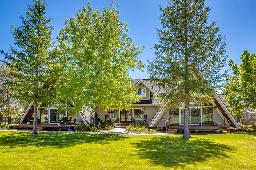 Take in the peace and quiet while enjoying the sun setting over the Cascade Mountains from this beautifully remodeled modern farmhouse on 8.49 acres.  Everything in this home has been touched!  Enjoy the soaring high ceilings in this double A frame home with hardwood floors throughout main level, updated kitchen with all new SS appliances, new carpet in all bedrooms, all bathrooms have been remodeled, new roof on both home and shop, and much more!  Featuring two primary suites on the main level, additional bedroom upstairs and a HUGE 4th/Bonus room with walk in closet over the garage.  Gorgeous property with 2.5 acres of irrigation, fenced pasture with underground sprinklers, shop/barn with 4 stalls, potting shed & raised beds plus a chicken coop. This would make a great home for multigenerational living if needed!  
Wine & Cheese Open House Friday 3-5 and Open House Saturday 1-3.