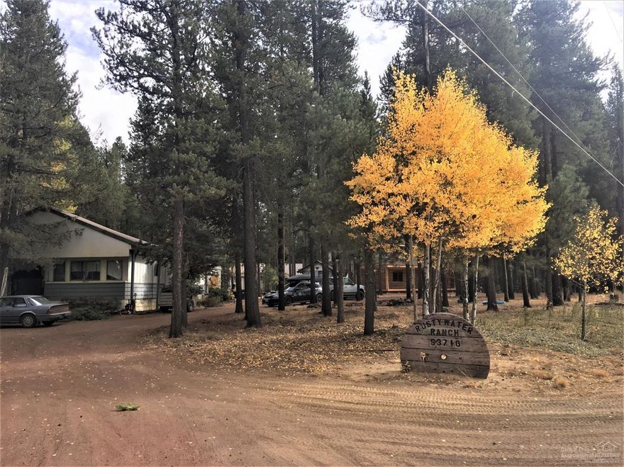 Front yard borders Deschutes National Forest! Only ten minutes to the Deschutes River and boat launch. Property has mature Ponderosas and pines along with aspens. So much storage! Two sheds and a turn around u-shaped driveway. RV carport on north side of the lot.